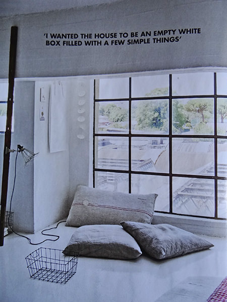 Minimalist lounge area with floor cushions in a modernist mill featured in Elle Decoration magazine Minimalist lounge area with floor cushions in a modernist mill featured in Elle Decoration magazine