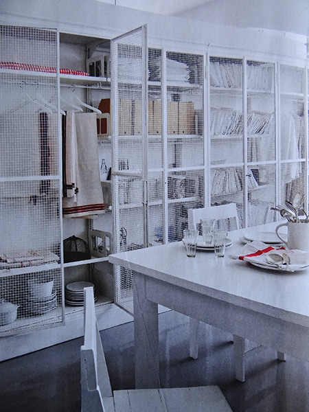 Tall, white wire cage storage in a modernist mill featured in Elle Decoration magazine Tall, white wire cage storage in a modernist mill featured in Elle Decoration magazine
