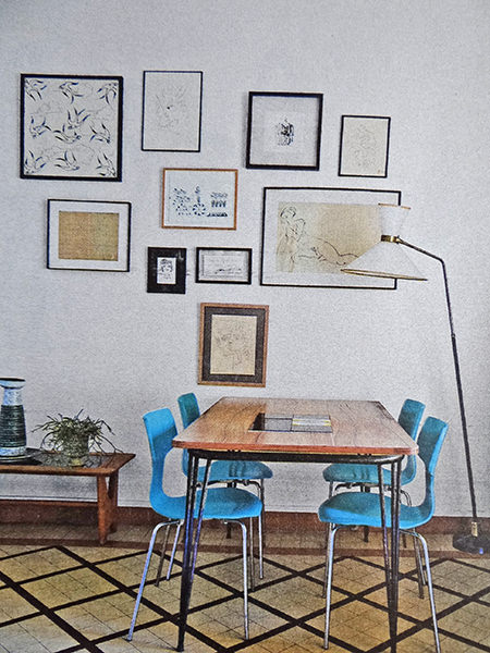 Dining table in a mid century modern decorated sitting room Dining table in a mid century modern decorated sitting room