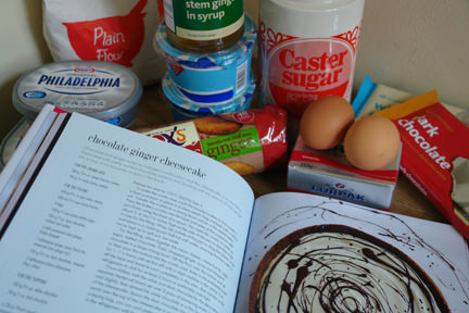 "Cheesecake" book by Hannah Miles with ingredients to make a chocolate & ginger cheesecake