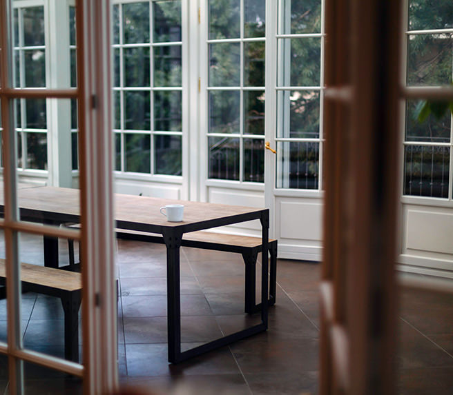 Dining table in a conservatory Dining table in a conservatory