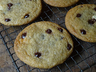 Dark and white chocolate chip cookies cooling on a wire rack | H is for Home