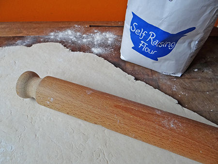 Rolling out jam roly poly pastry mixture