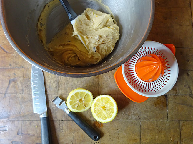 Madeira cake batter in a mixing bowl with sliced and zested lemon | H is for Home