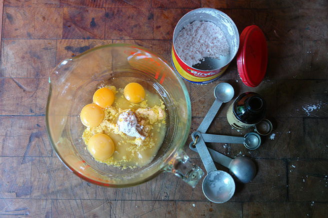 Measuring jug with eggs, custard powder and vanilla essence