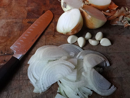 slicing onions and garlic