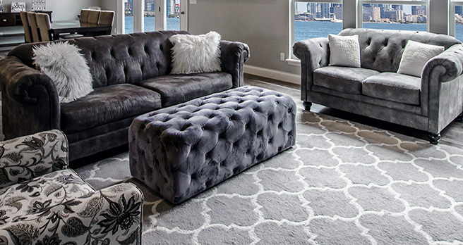 Grey buttoned ottoman