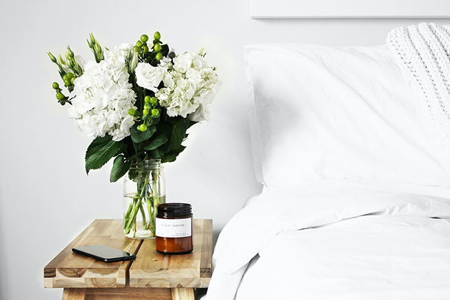 Bedside with white linen