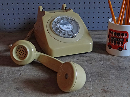 vintage cream coloured GPO telephone with receiver off the hook