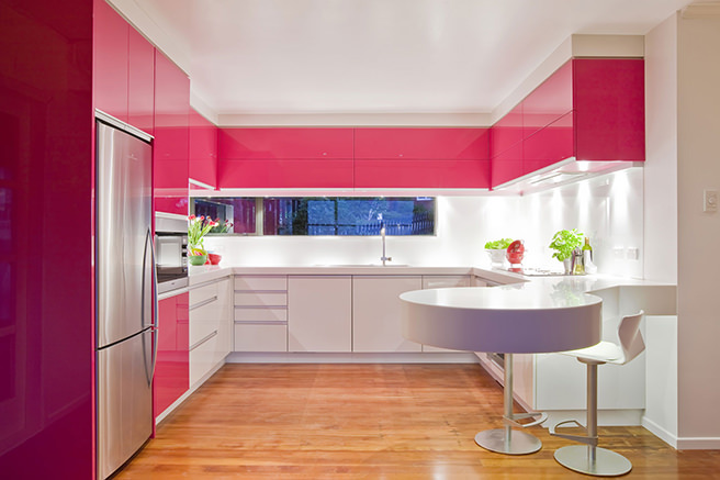 Glossy hibiscus pink and white fitted kitchen cabinets