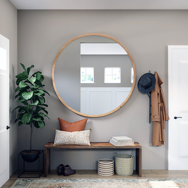 Large circular mirror in a hallway