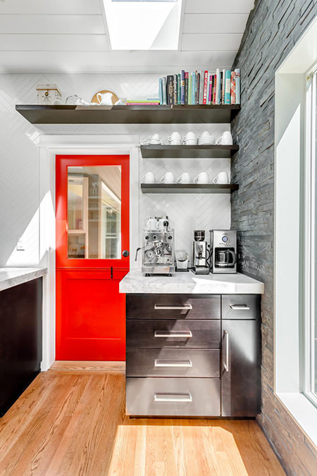 Fire engine red door leading out of a kitchen