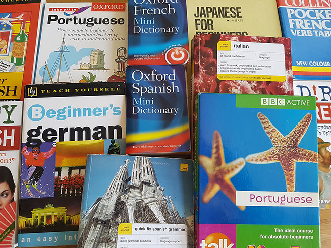 Stack of dictionaries on different European languages
