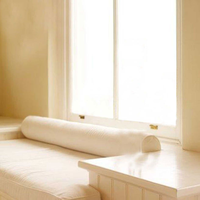 Cream room with light streaming through a window