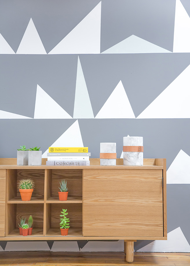 Grey and white feature wall decorated with triangles