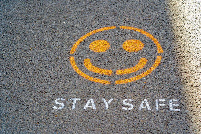 'Stay safe' stenciled on to a road surface