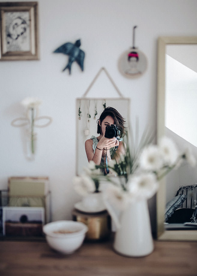 Woman photographing the interior of a home