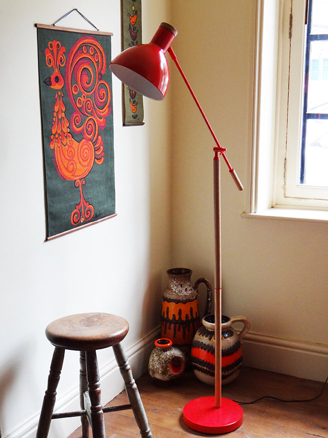 Red contemporary floor lamp with antique stool and vintage West German fat lava vases | H is for Home