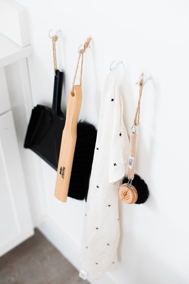 Cleaning tools hanging on a wall