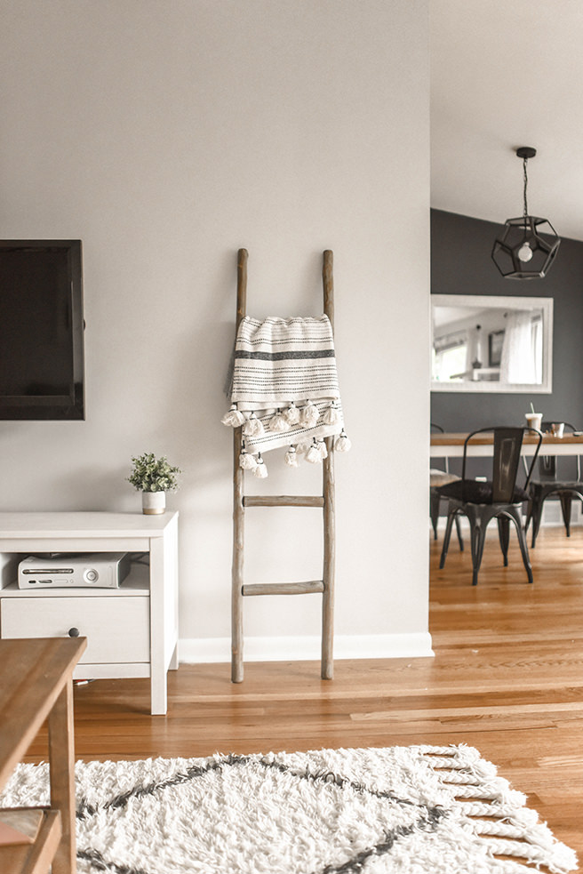 Monochrome interior with cream shaggy rug in the foreground